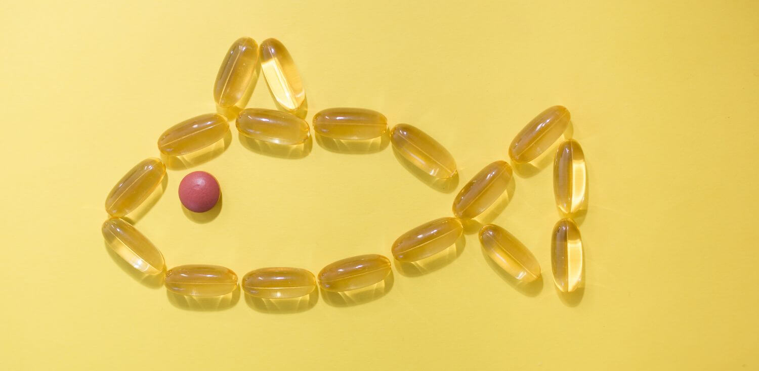 a group of pills arranged in the shape of a fish