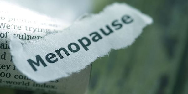 menopause written in a piece of paper