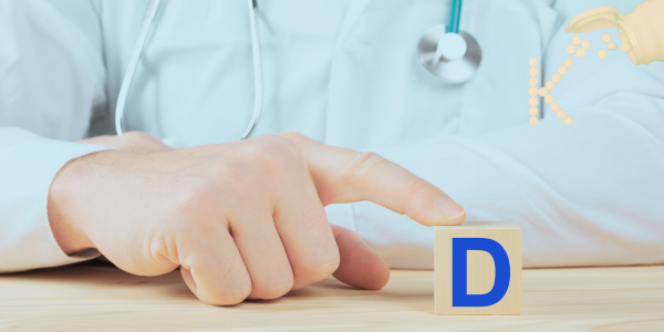 A doctor holding a block with the letter d on it