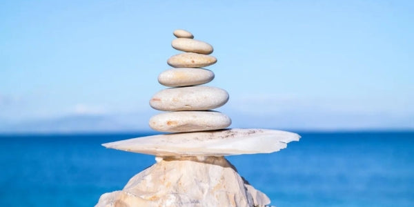 A stack of rocks sitting on top of a beach